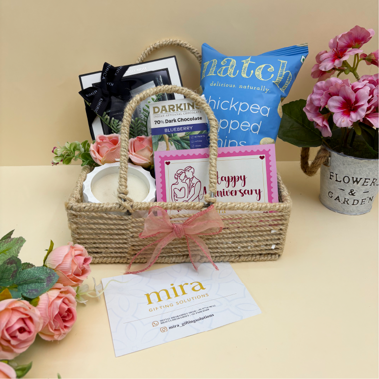 Gift basket with products and flowers on a table, featuring 'mira' brand.