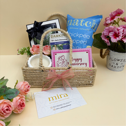 Gift basket with products and flowers on a table, featuring 'mira' brand.