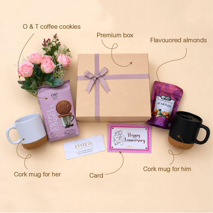 Gift set with coffee cookies, almonds, mugs, and a card on a beige background