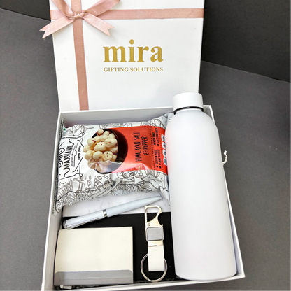Gift set with white water bottle, notebook, pen, and popcorn snack in a 'mira' branded box.