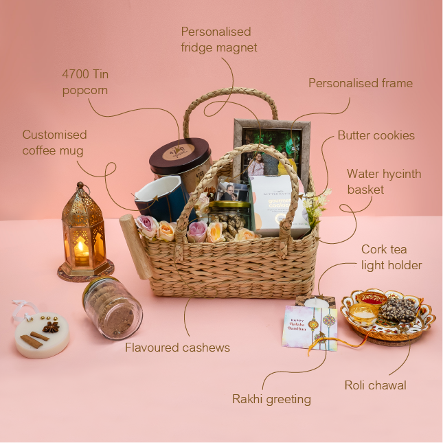 Gift basket with various items on a pink background