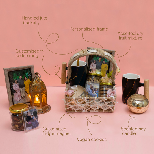 Gift basket with various items on a pink background